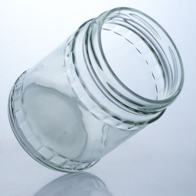 食品級の生産と流通のための透明の丸型石灰石ガラスボトル